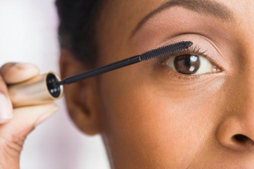 woman applying mascara