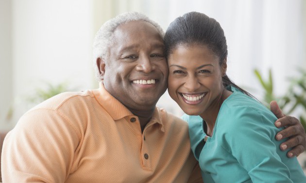 Father and daughter hugging in living room