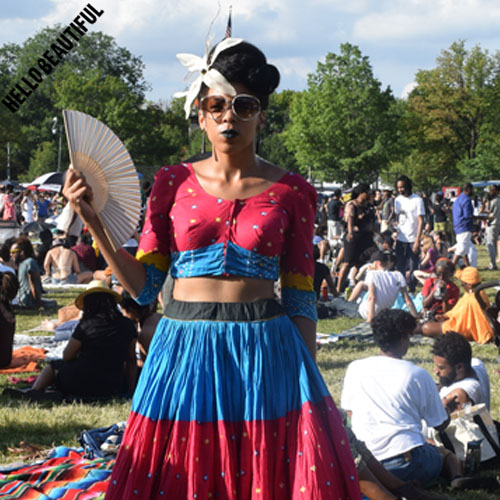 Looking and keeping cool with a handfan. 