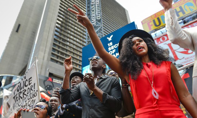 Janelle Monae (right), a singer with Wondaland, gestures...
