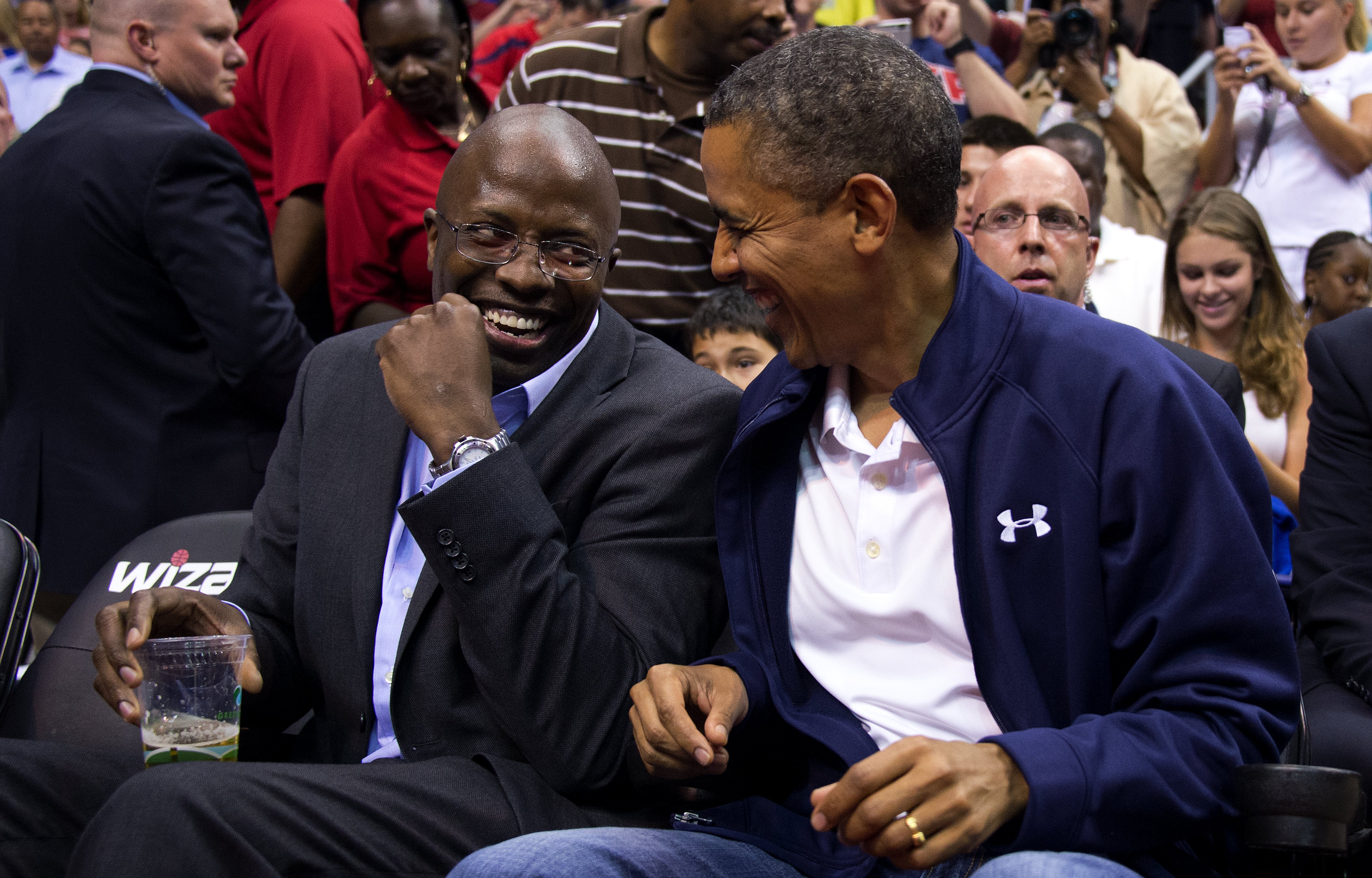 US President Barack Obama (R) shares a l