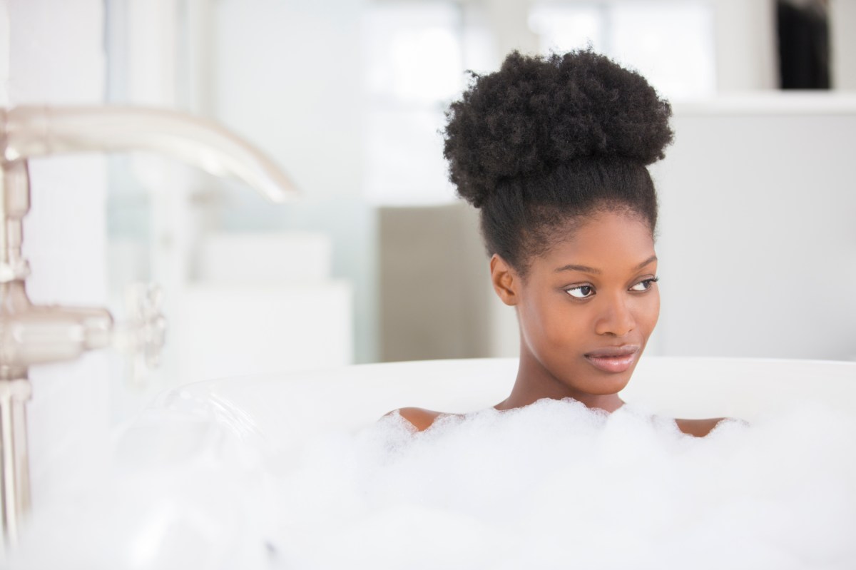 Woman relaxing in bubble bath