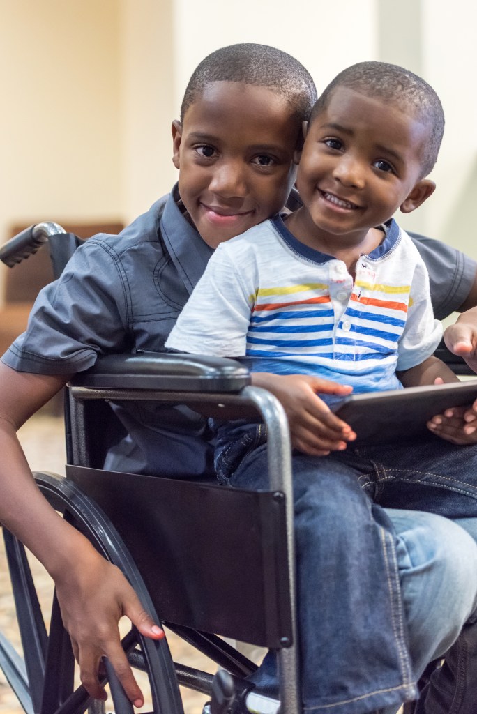 Handicap child playing with his little brother