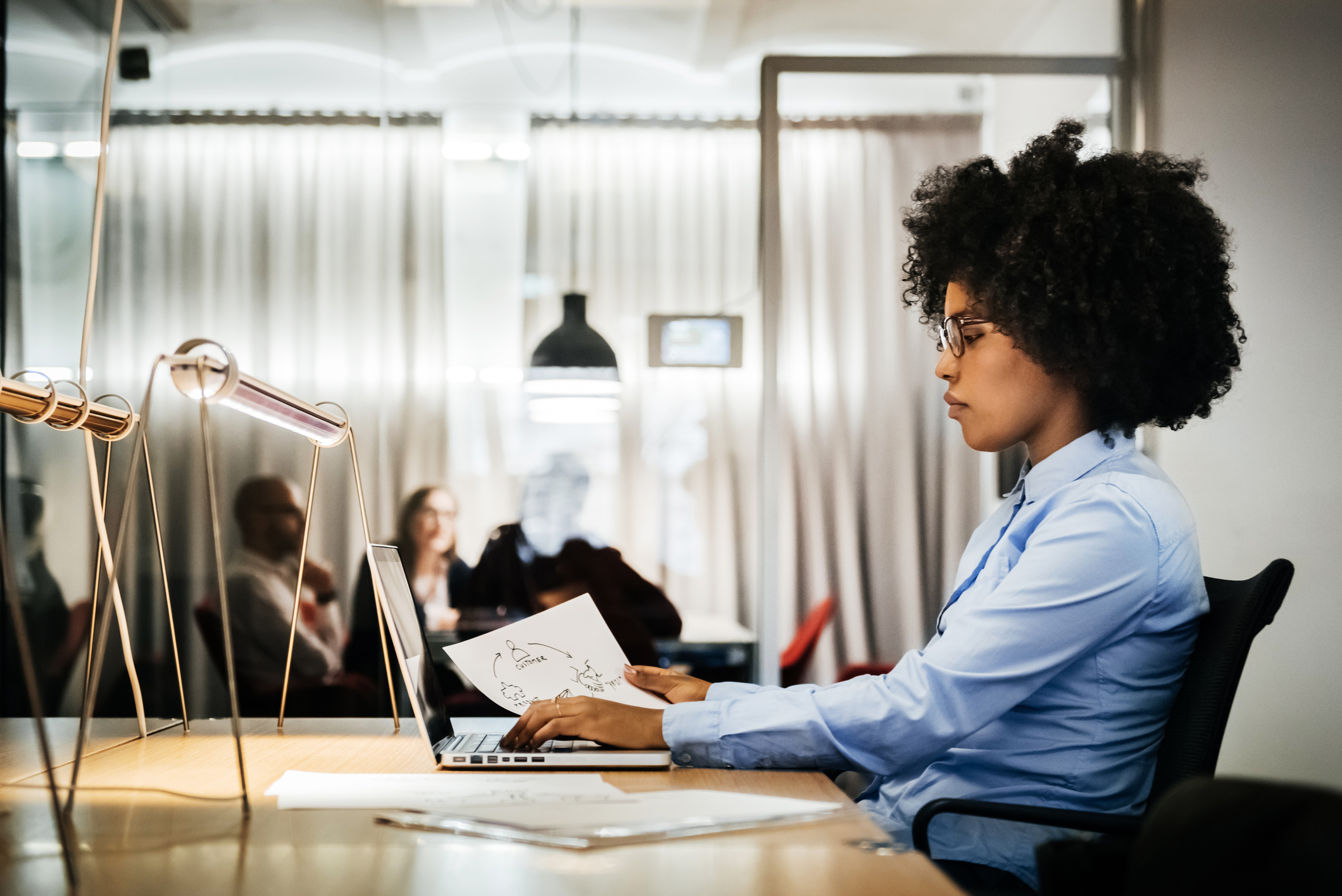 Young black businesswoman working in office