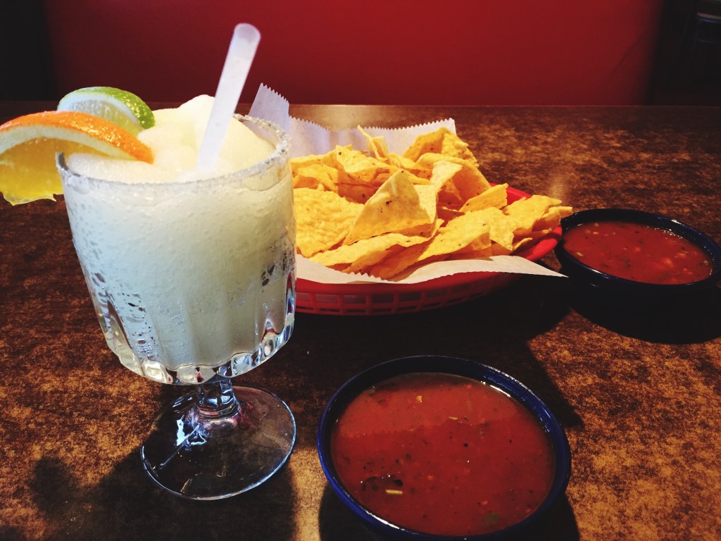Close-Up Of Margarita And Food On Table
