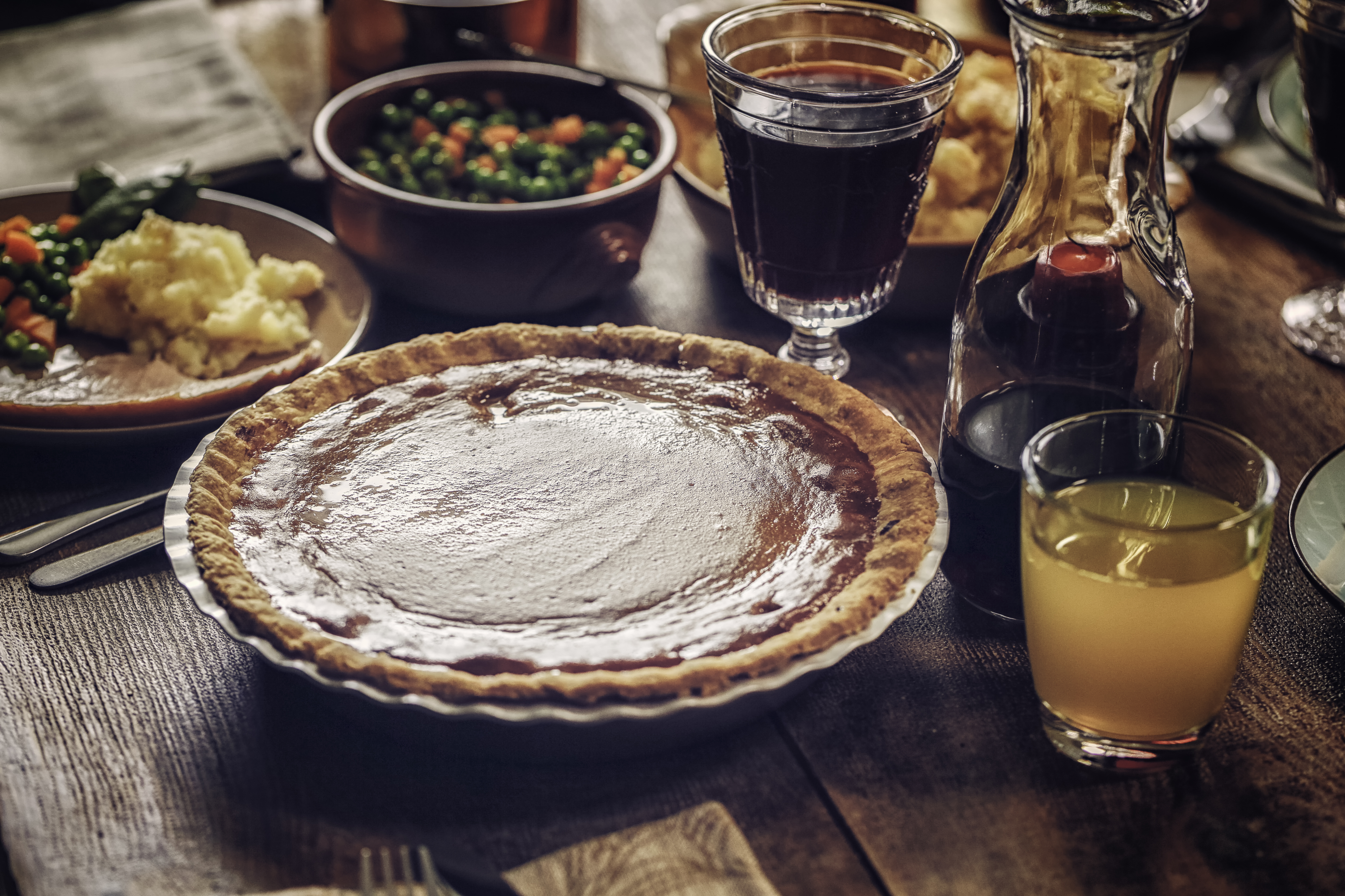 Traditional Stuffed Turkey Holiday Dinner with Vegetables and Pumpkin Pie