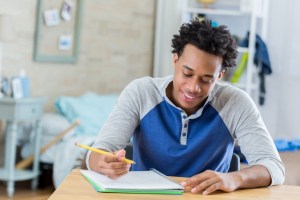 African American student works on homework