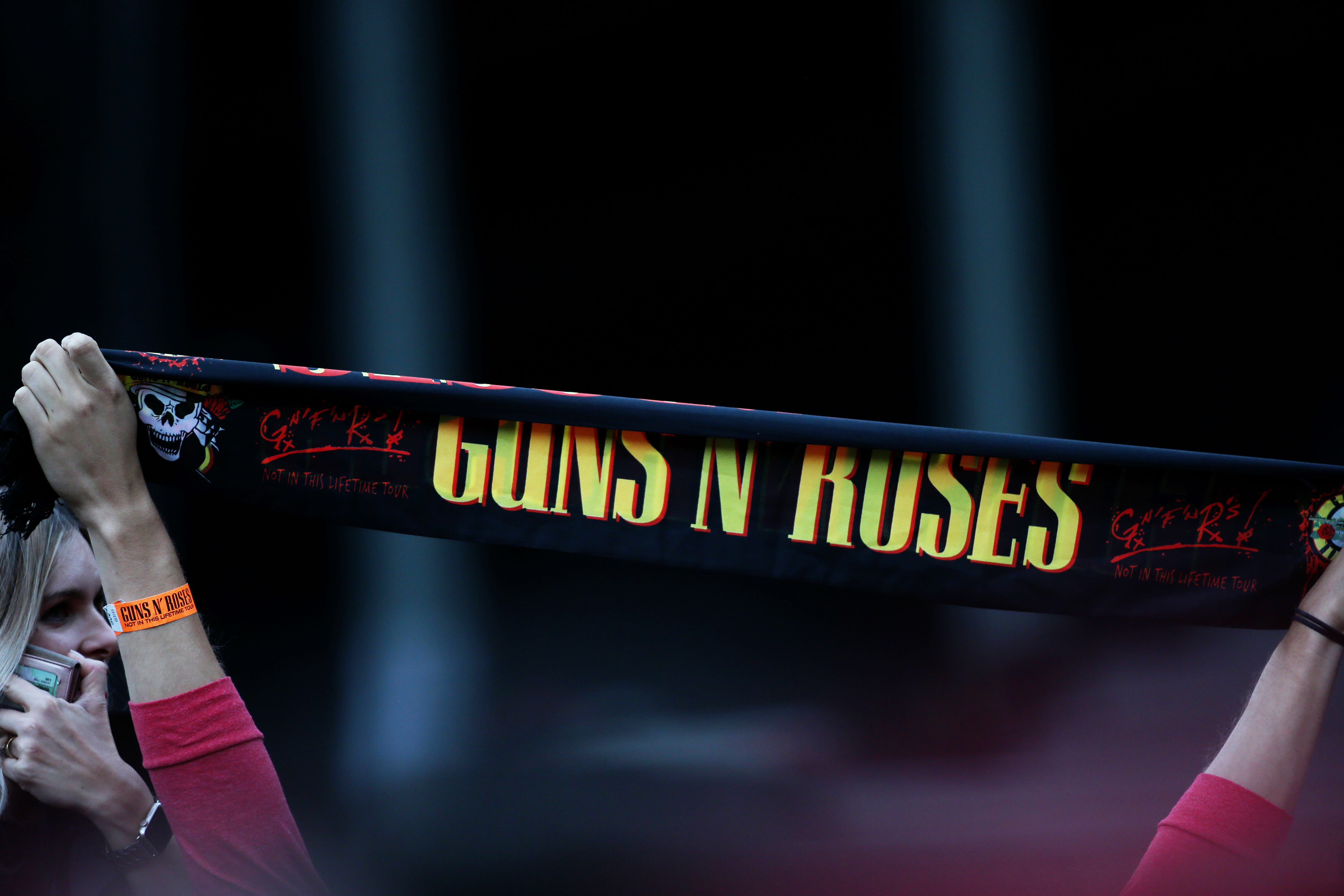 Which Artist Got Guns and Roses Tattoed On The Back Of Their Head?