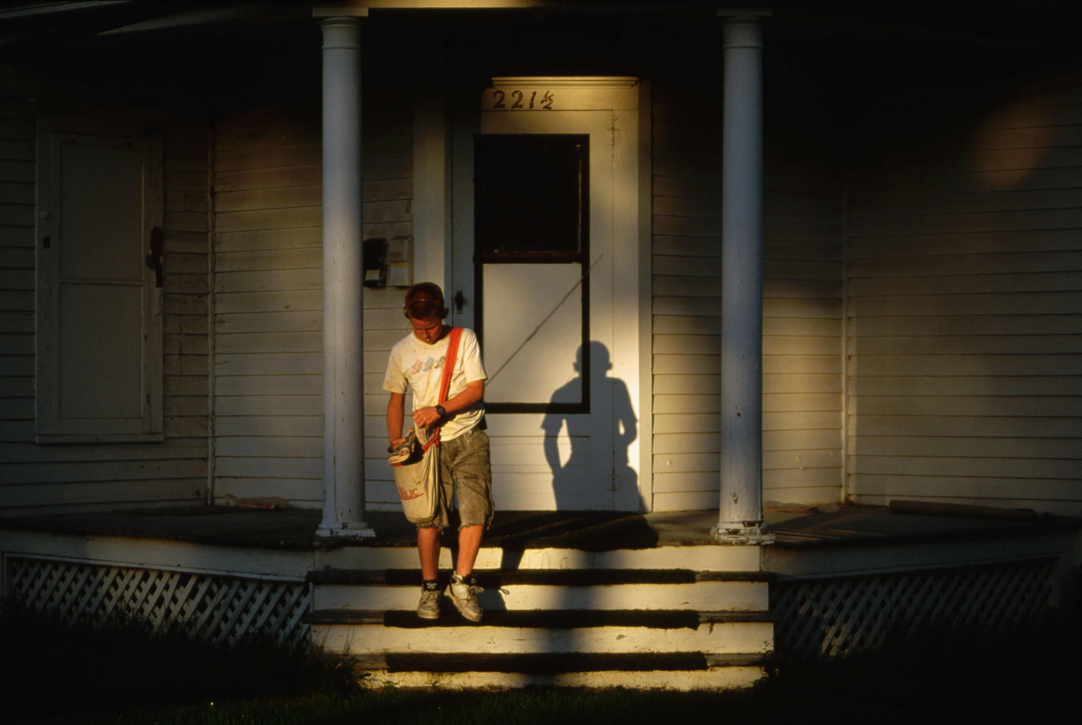 Newspaper Boy Delivering Morning Paper