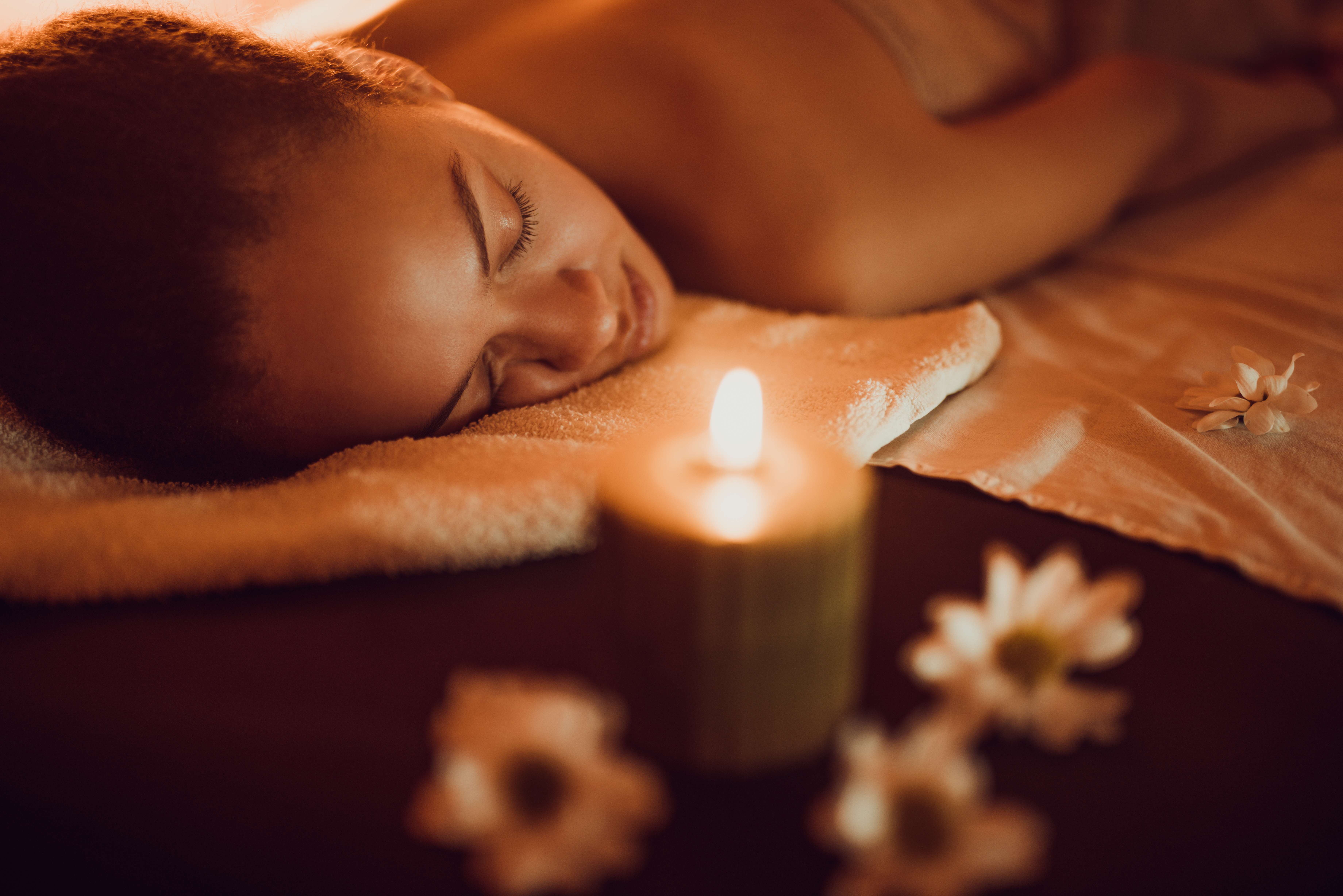 Serene African American woman relaxing at the beauty spa.
