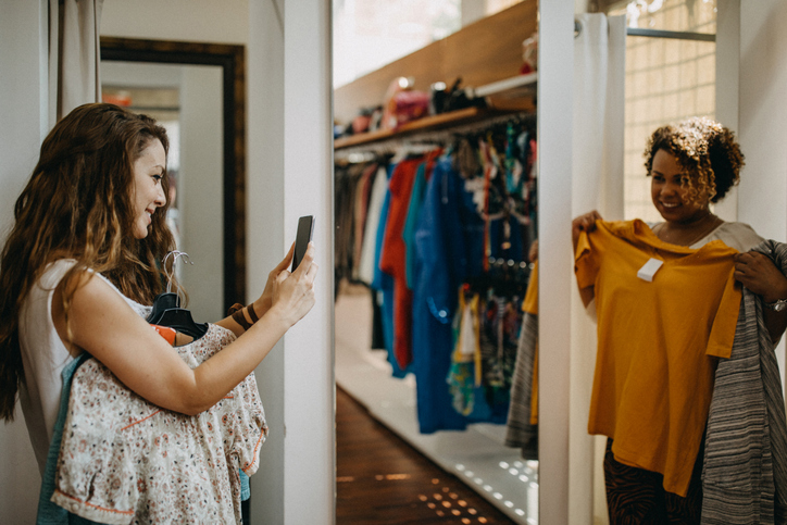Young women vintage clothes shopping