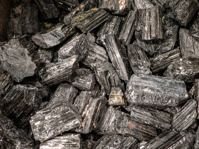 LONDON, UK - APRIL 15, 2019: Collection of black tourmaline semi precious stones and minerals.