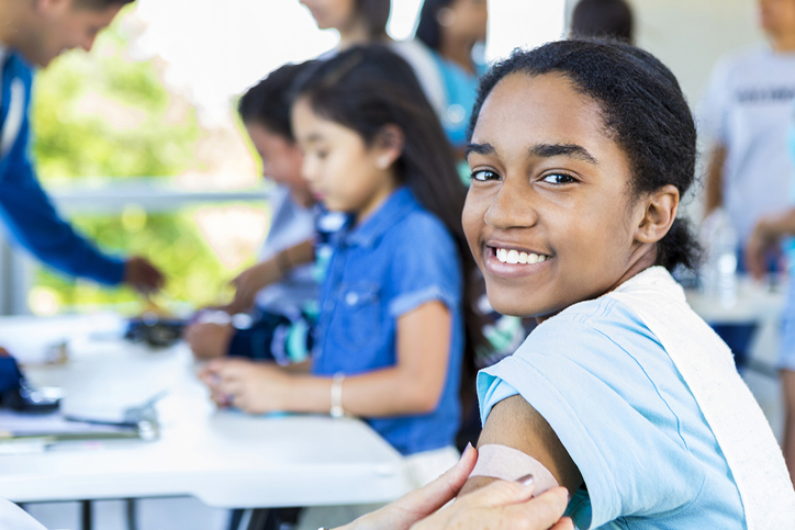 Smiling African American Girl after getting a vaccination