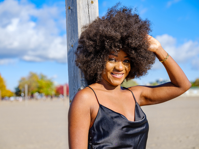 African woman on a sandy beach