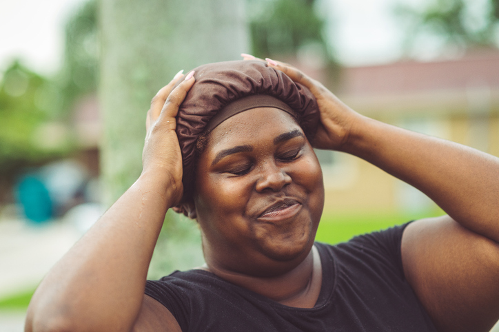 African American woman in a hair cap