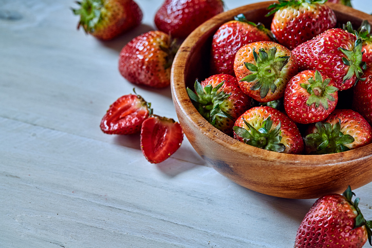Fresh strawberries on a wooden table