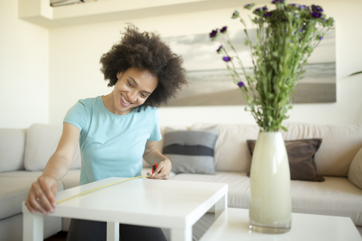 Cheerful African American woman DIY at home
