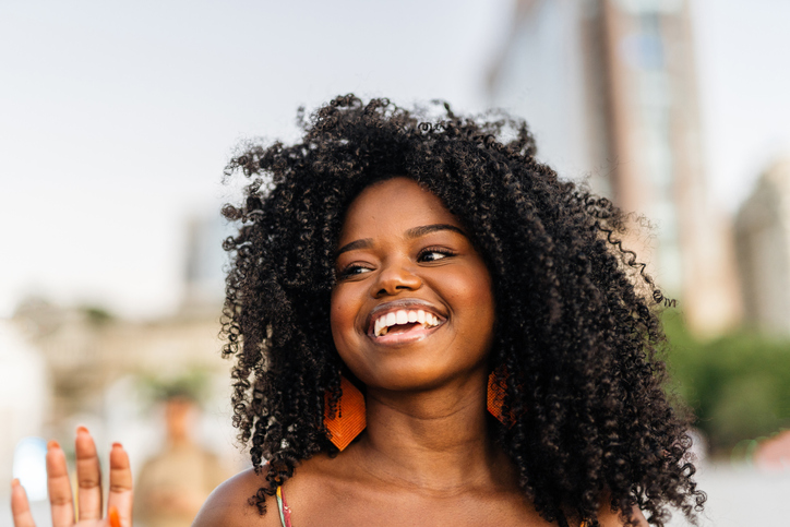 Smiling black woman in the city