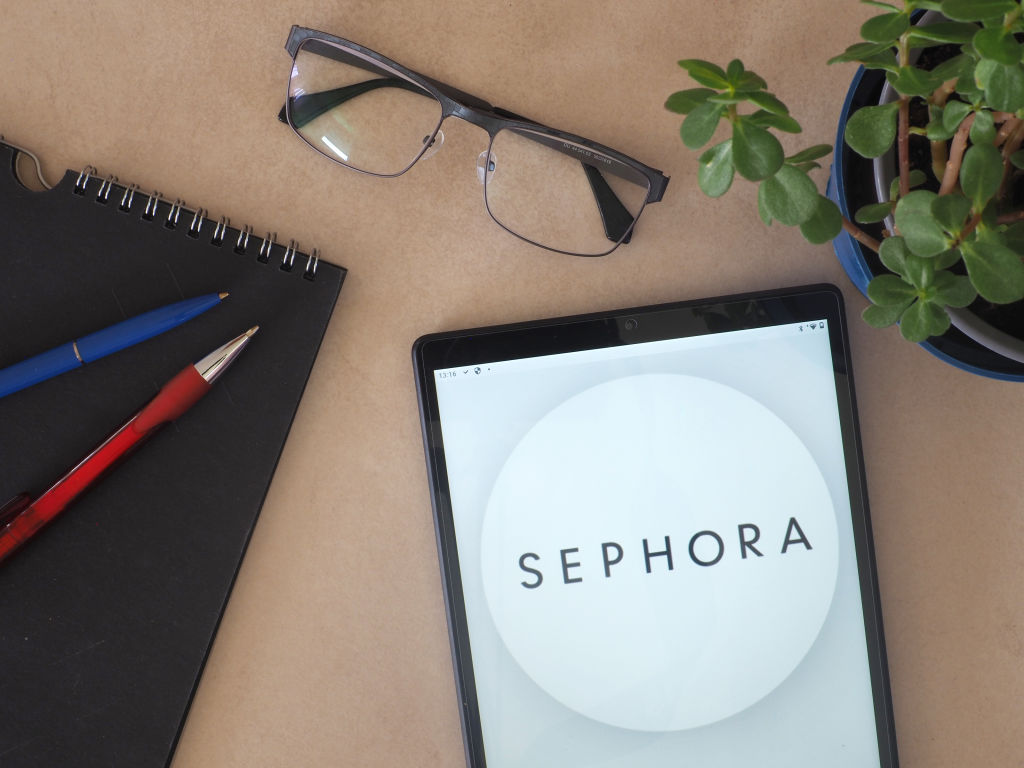 In this photo illustration, Sephora logo seen displayed on a...