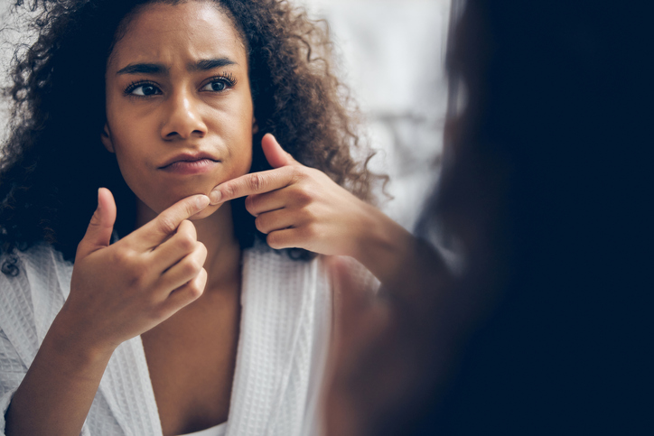 Serious young woman performing a beauty procedure