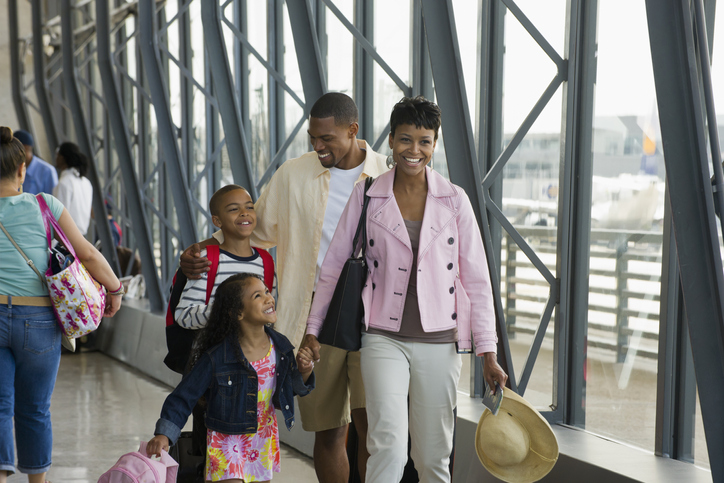 Family walking together in airport