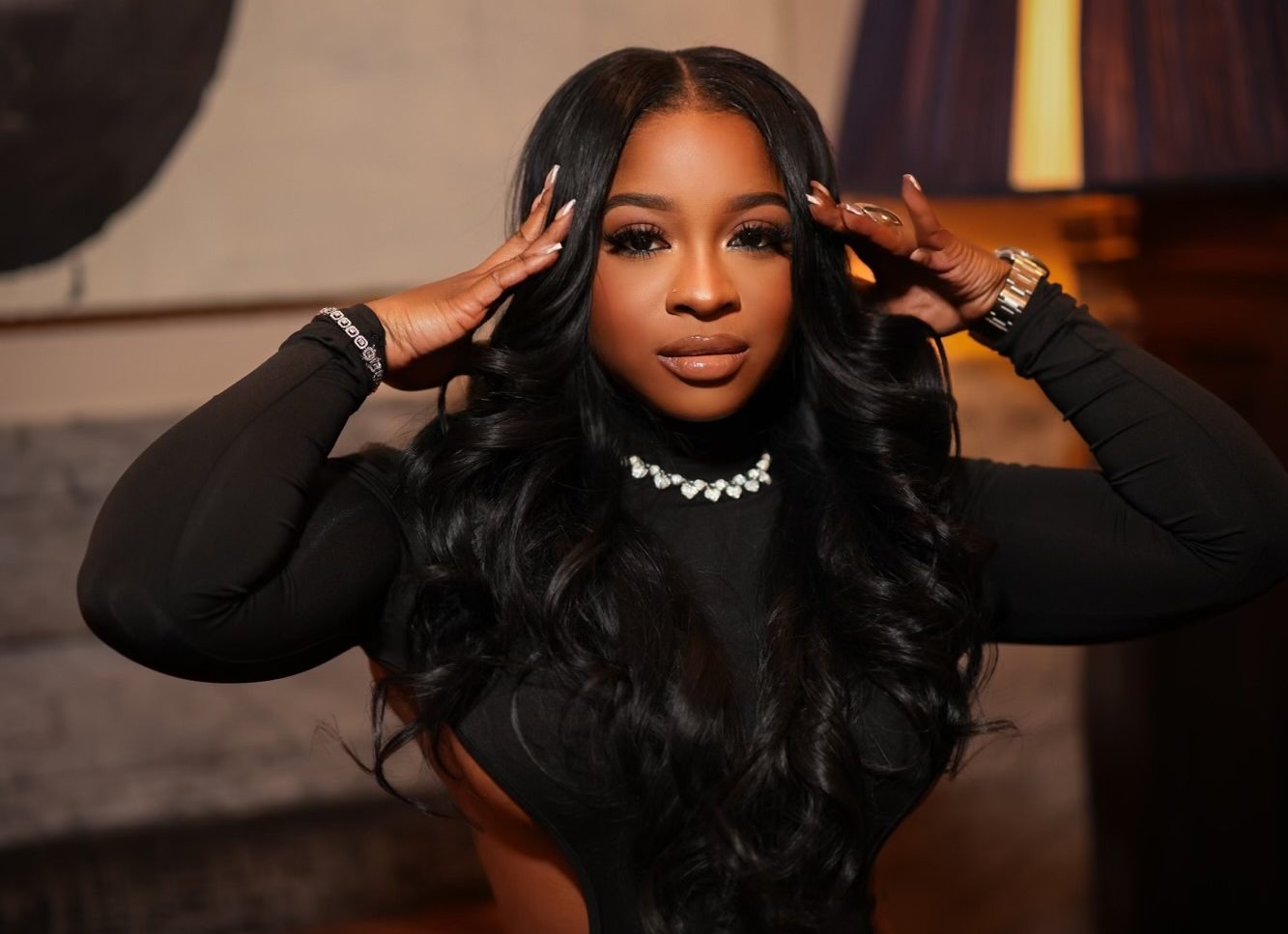 EXCLUSIVE: Reginae Carter Tries Black