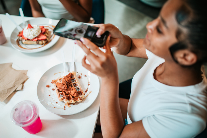 Young Women Photographing Brunch With Smartphones