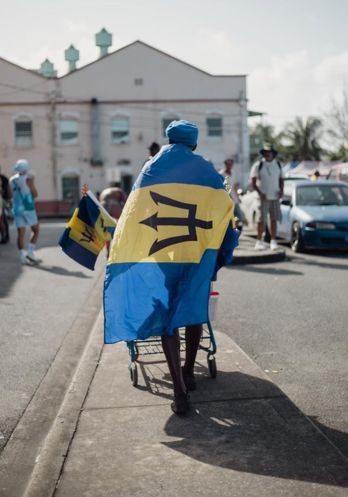 Man wrapped in Barbados flag