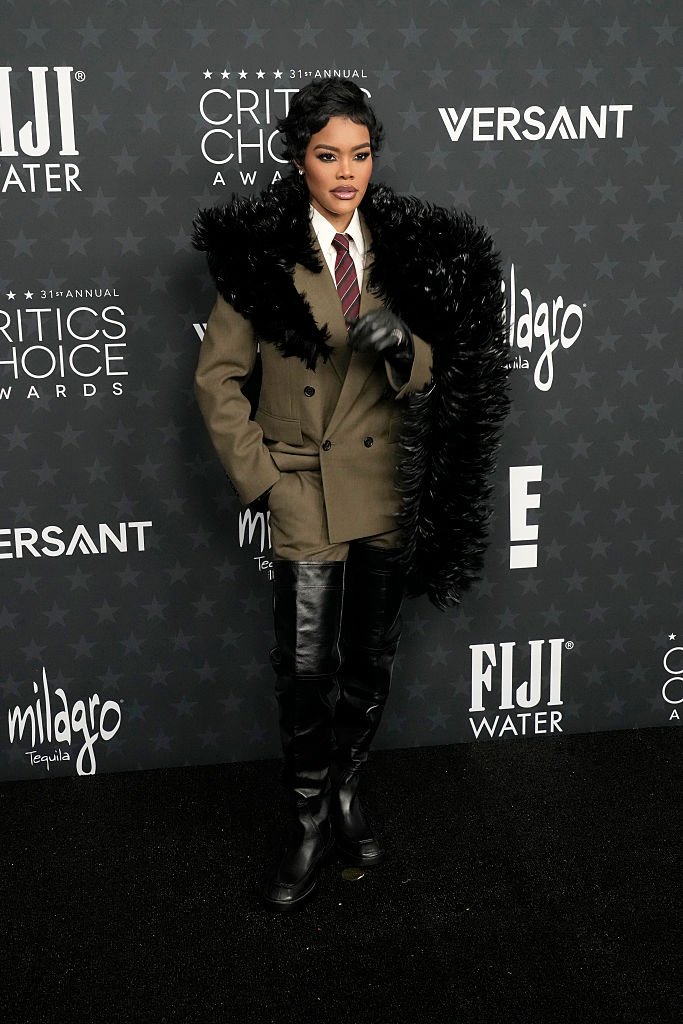 Teyana Taylor Is Poised In Army Green Menswear & Knee High Boots